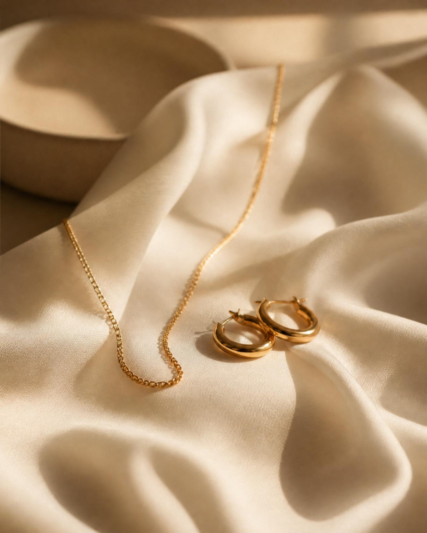 Gold jewellery on silk